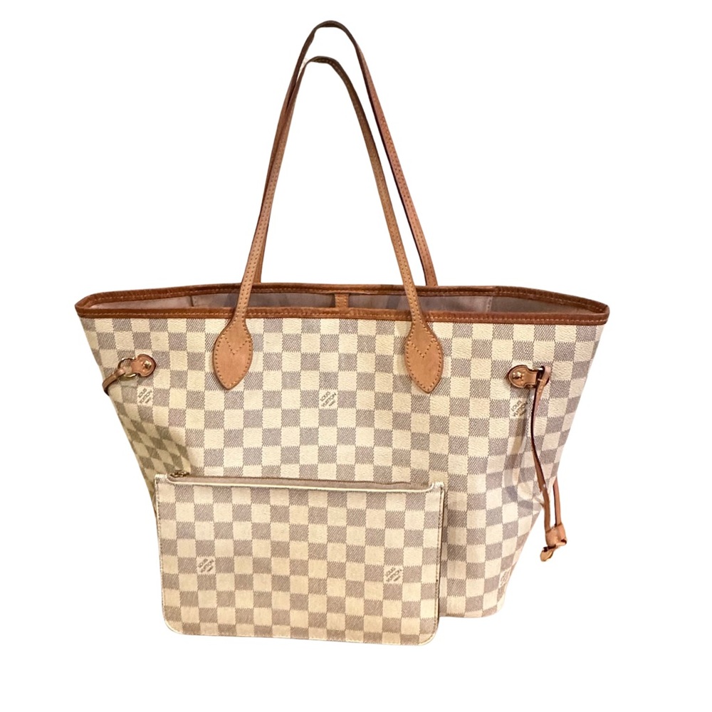 Louis Vuitton never full bag and clutch .